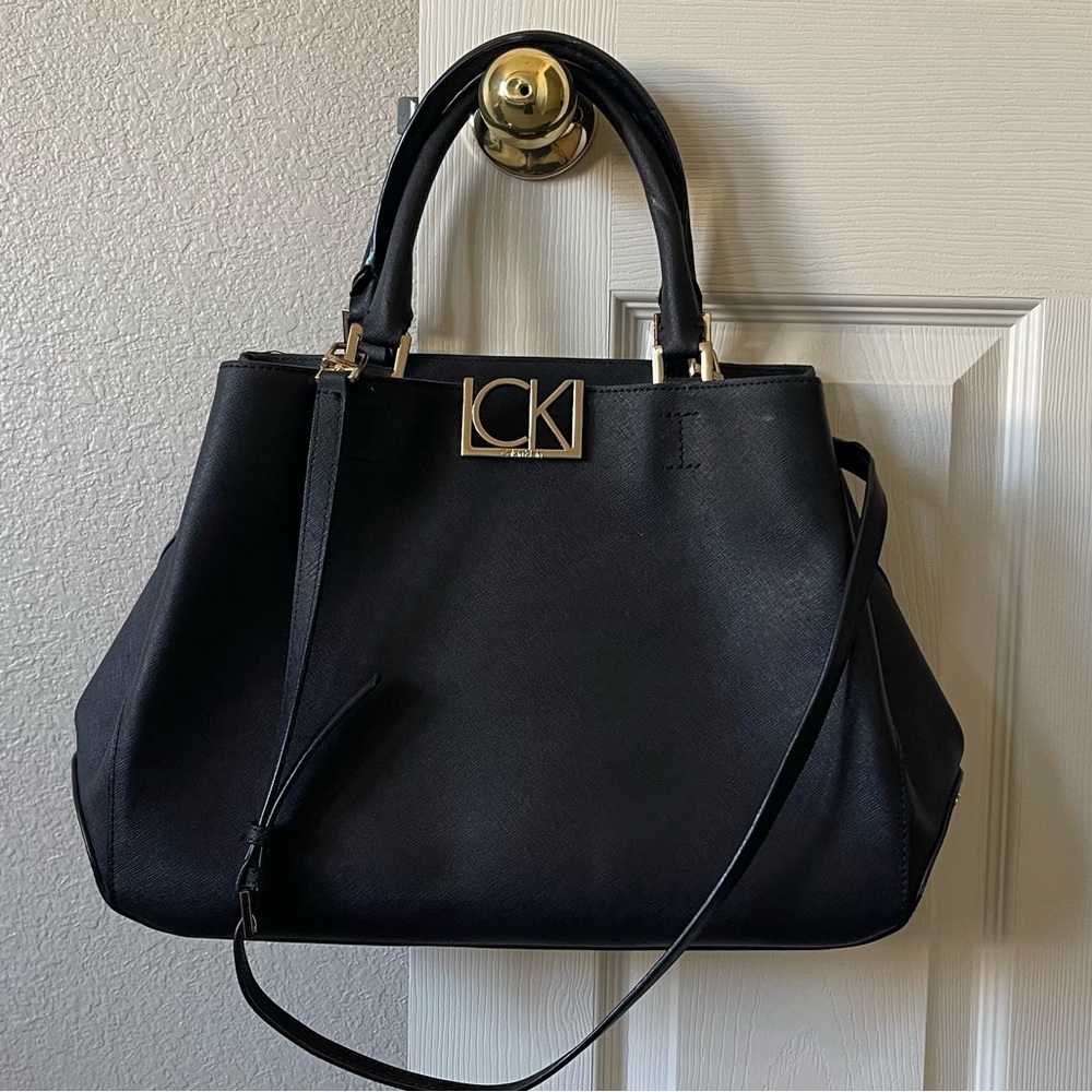 Calvin Klein - cross-body bag with different compartments.